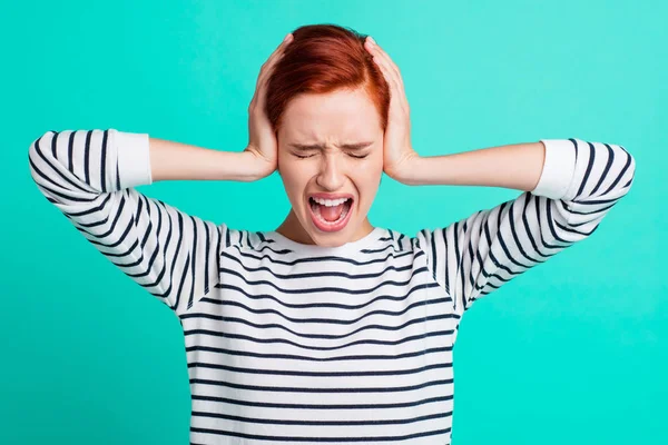 Portrait of charming attractive mad distracted red-haired lady wearing striped pullover holding palms on head opened mouth isolated over bright vivid shine green turquoise background