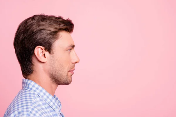 Close up side profile photo of pretty attractive he him his man relaxed watching to empty space ideal appearance wearing casual shirt outfit isolated on pale rose background