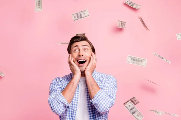 Portrait of his he nice cute funny attractive handsome cheerful cheery guy wearing checked shirt money flying in air celebrating wealth omg wow isolated over pink pastel background — Stock Photo, Image