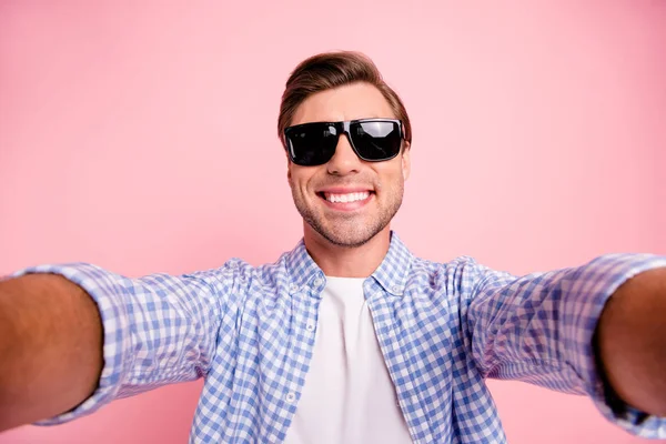 Close up photo of amazing brunet he him his handsome telephone make take selfie in black summer specs delight vacation rest relax period wear casual checkered shirt outfit isolated on rose background — Stock Photo, Image