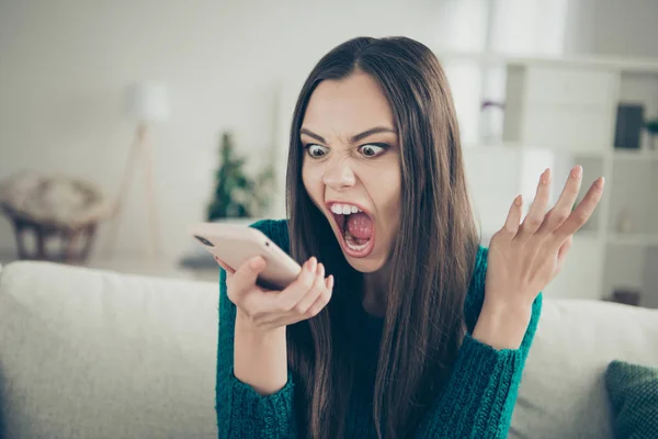 Closeup photo portrait of irritated aggressive displeased dissatisfied nervous anxious in bad mood pms she her girl screaming on telephone in hand