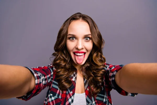 Close up portrait of amazing beautiful she her lady tongue out of mouth make funny faces take selfies do not care rules wearing specs checkered plaid shirt clothes isolated grey background — Stock Photo, Image