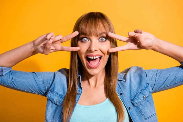 Close-up portrait of her she nice crazy emotional lovely gorgeous attractive cheerful straight-haired lady showing double v-sign near eyes isolated over bright vivid shine yellow background — Stock Photo, Image