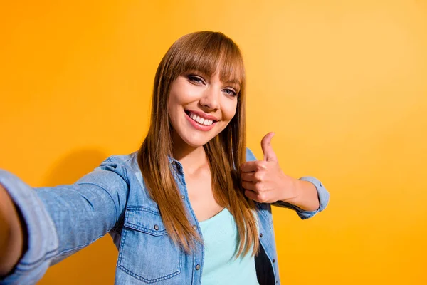 Self-portrait of her she nice sweet lovely lovable fascinating cool attractive cheerful straight-haired lady showing thumbup isolated over bright vivid shine yellow background — Stock Photo, Image