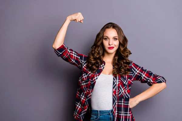 Portrait of nice-looking cute attractive lovely charming magnificent self-confident wavy-haired lady showing strength isolated over gray pastel background — Stock Photo, Image