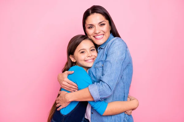 Portrait of two nice cute adorable lovable lovely attractive charming tender cheerful cheery positive girls hugging care trust feelings isolated over pink pastel background — Stock Photo, Image