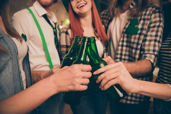 Cropped photo leprechaun style clothed five people company have bottles with alcohol drinks hands arms waiting beginning saint paddy day party love gathering meeting clink sound everywhere