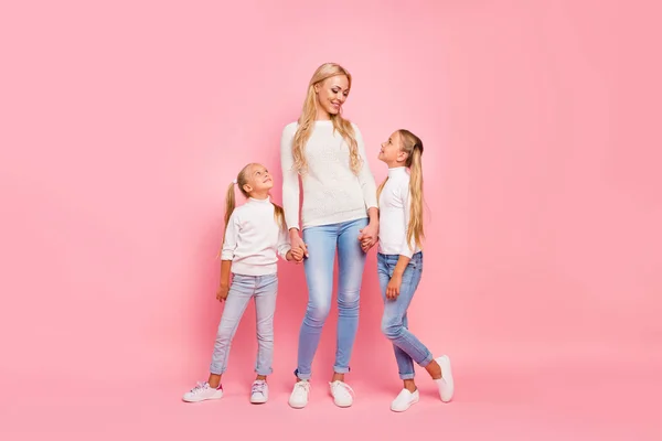 Full length size body portrait of nice cute attractive charming lovely lovable cheerful cheery kind people mom mum holding hands spending free spare time isolated over pink pastel background