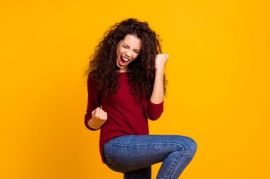 Close up photo amazing beautiful her she lady all possible yell voice raised fists hip in delight like rock star guitar wear red knitted sweater pullover clothes outfit isolated yellow background clipart