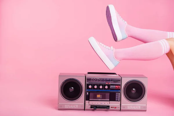 Cropped close up photo skinny perfect ideal she her lady legs raised up lying near boom box playing fitness training workout press swing happy soundtrack turned on isolated pink rose background — Stock Photo, Image
