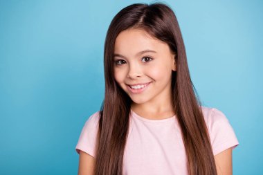 Close-up portrait of her she nice cute lovely sweet adorable well-groomed attractive cheerful cheery straight-haired brunette girl isolated over blue pastel background clipart