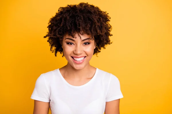 stock image Close up photo beautiful amazing she her dark skin lady toothy beaming smiling optimistic wavy curly pretty wear casual white t-shirt isolated yellow bright vibrant vivid background