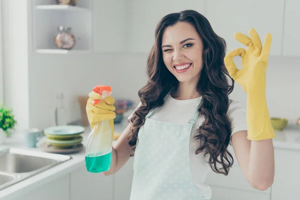 Close up photo cheerful beautiful busy nice duties she her lady house hold okey symbol washing supplies pulverize promo wear jeans denim casual t-shirt covered by cute apron bright light kitchen — Stock Photo, Image