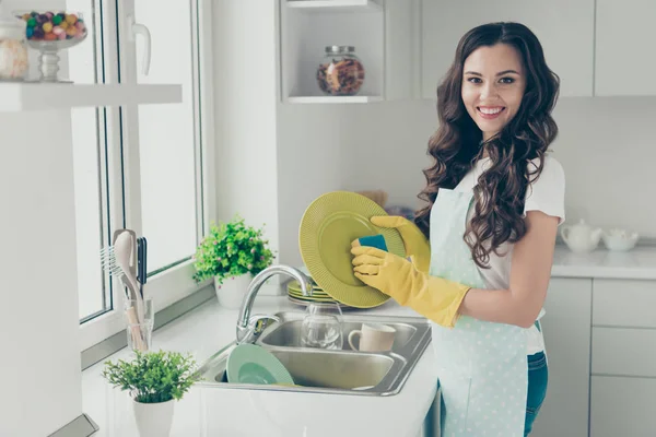 Portrait of her she nice cute lovely charming attractive beautiful cheerful cheery wavy-haired house-wife polishing shine glossy perfect plates in modern light white interior indoors hotel room — Stock Photo, Image