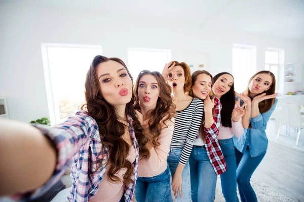 Close up photo cheerful beautiful she her ladies big family roommates having fun best buddies make take selfies funny facial expression excited amazed bright white room girls day indoors — стоковое фото