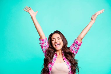 Portrait of her she nice attractive cheerful optimistic wavy-haired lady wearing checked shirt lottery winner great best raising hands up isolated over teal turquoise bright vivid shine background clipart