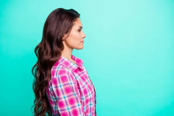 Close up side profile photo beautiful she her lady look watch see empty space attentively observe wearing casual plaid checkered pink shirt outfit isolated teal bright vivid background — Stock Photo, Image