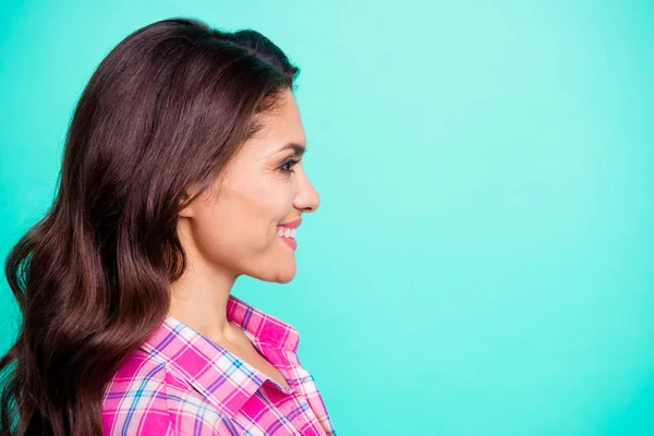 Close up side profile photo amazing white teeth beautiful she her lady look watch see empty space attentively wearing casual plaid checkered pink shirt outfit isolated teal bright vivid background — Stock Photo, Image