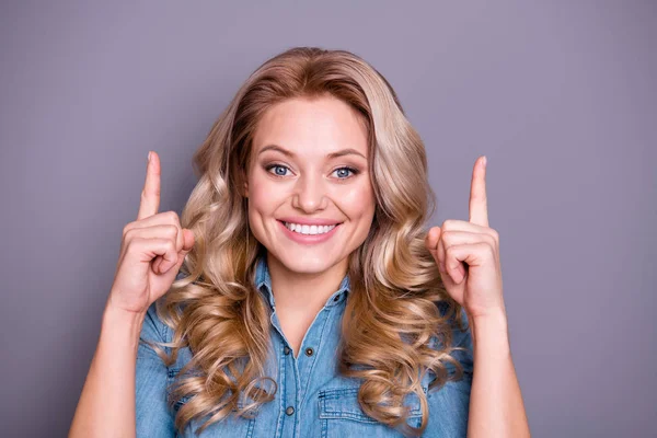 Close up photo amazing beautiful she her lady hold arms hands index fingers point up empty space suggest buy buyer new product wearing casual jeans denim shirt clothes outfit isolated grey background — Foto de Stock