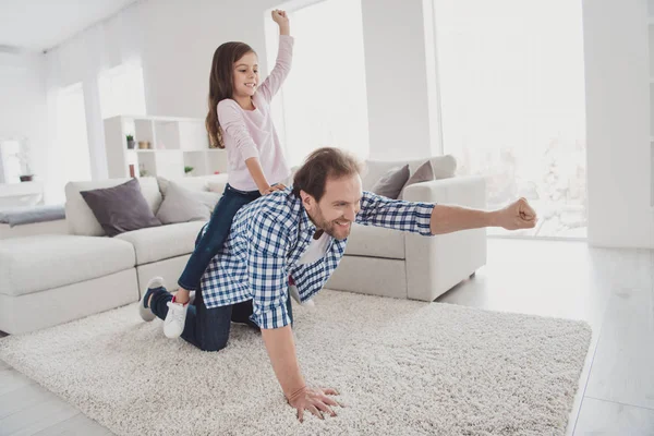 Portrait of his he her she nice lovely attractive pre-teen cheerful cheery positive girl handsome bearded dad daddy having fun on carpet in light white interior room indoors — Stock Photo, Image