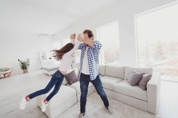 Full length body size view portrait of nice adorable attractive cheerful funny pre-teen girl dad daddy having fun flying daydream dream morning dancing in light white interior room indoors — Stock Photo, Image
