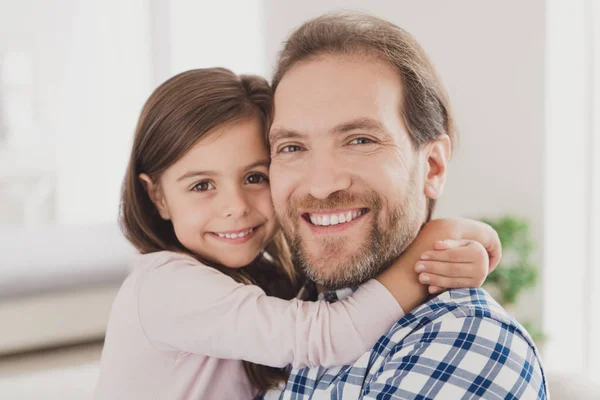 Close up photo two little she her lady girl handsome beard bristle he him his father guy hold hands homey indoors glad togetherness lovely look on camera great morning sunday light flat house — Stock Photo, Image