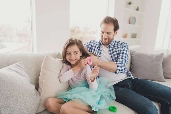Close up photo little she her girl handsome he him his father hold princess hair making pigtails ponytails braids morning sunday wear jeans denim checkered plaid shirt light house sit cozy divan — Stock Photo, Image