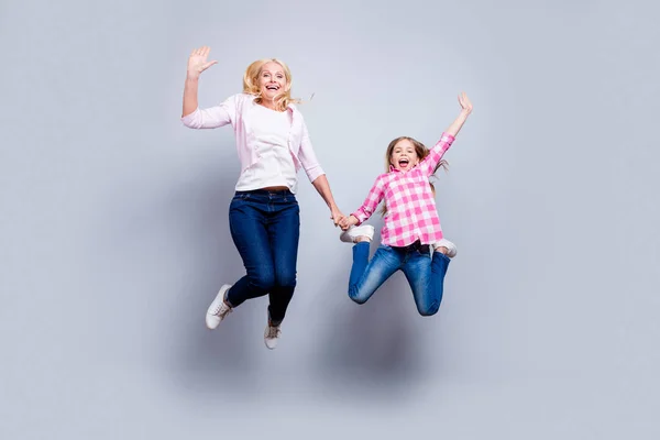 Full length body size photo blond haired she her little mature granny waving hands jump high achievement wear casual shoes jeans plaid checkered shirt sweater outfit clothes isolated grey background — Stock Photo, Image