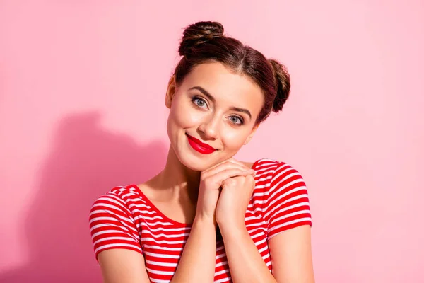 Close up photo beautiful she her lady pretty two buns bright pomade lipstick touch hold one cheek cheekbone lying arms hands together wear casual striped red white t-shirt isolated pink background — 图库照片
