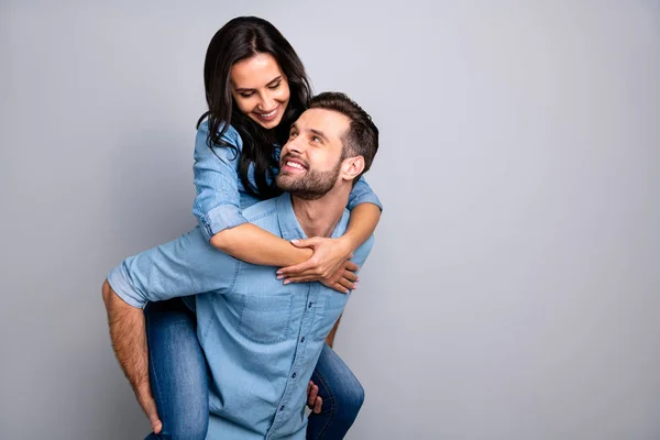 Close up photo funky cheer crazy she she he he his couple in love lady guy best friends piggyback ride buddies fellow wear casual jeans denim shirts outfit clothes isolated light grey background — Foto de Stock