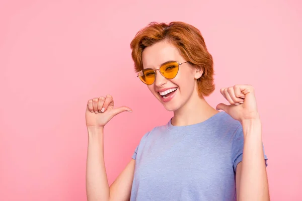 Close-up portrait of her she nice cute charming attractive lovely cheerful cheery girl wearing casual blue t-shirt yellow glasses pointing at herself thumbs isolated over pink background — Stock Photo, Image