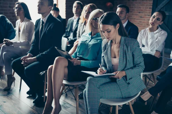 Crowd of nice attractive stylish trendy elegant busy sharks crowd attending educative forum event listening to company ceo making notes at industrial loft interior work place space indoors — Stock Photo, Image