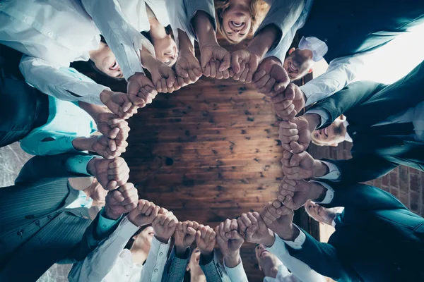 Close up low angle view photo business people round circle she her he him his hold hands arms fists together celebrate project prize nomination power inspiration all dressed formal wear jackets shirts — Stock Photo, Image