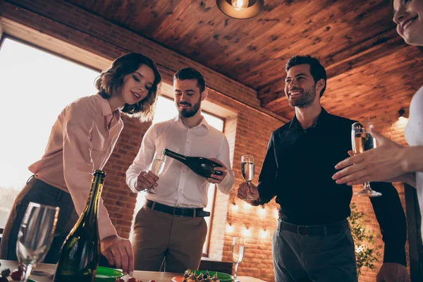 Low below angle view of nice elegant attractive lovely pretty cheerful cheery positive guys ladies gentlemen having fun brunch Easter day spring tradition in industrial loft interior room indoors — Stock Photo, Image