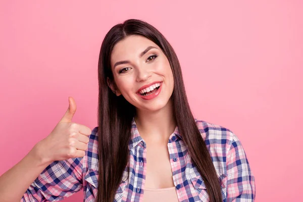 Close up photo amazing beautiful her she lady hand arm thumb raised up white teeth like novty tested quality information wear casual checkered plaid shirt clothes outfit isolated pink background — Foto de Stock