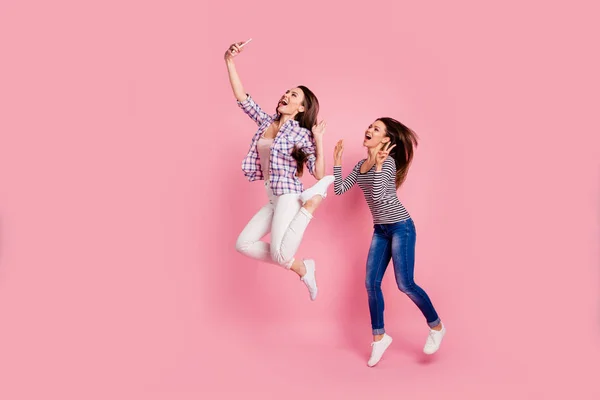 Say hi Full length body size photo of positive students girl bloggers have free time rest video call laugh scream blogging show make v-sign wear blue jeans bright shirts isolated on pink background