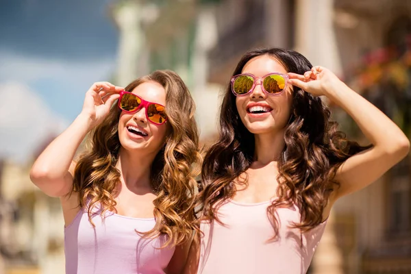 Unforgettable moments. Nice attractive elegant classy ladies best students travel trip feel hairstyle glad satisfied wear long hair colorful specs modern pink pastel clothes look center outside — Stock Photo, Image