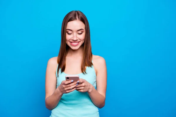 Close up photo beautiful amazing she her lady hold hands telephone smart phone look write send love letter check email wear casual tank top outfit clothes isolated blue bright background — стоковое фото