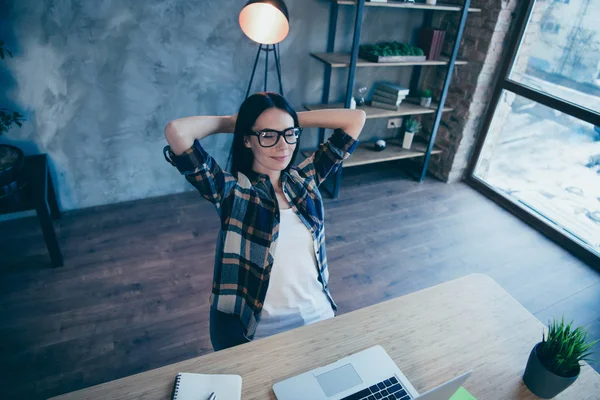 Above high angle view of nice cute attractive charming ceo boss chief dreamy brunette lady in checked shirt sitting in front of laptop rest time at industrial loft style interior work place station — 图库照片