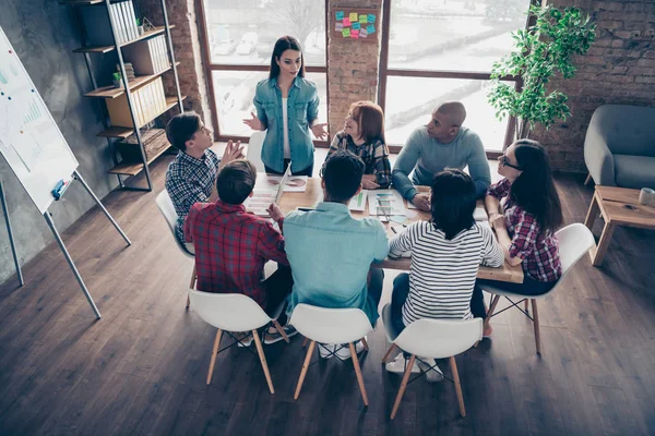 Charming inspired leader boss leadership explaining presenting strategy tip having communication with professionals corporate dressed in casual shirts in big office — Stock Photo, Image