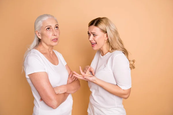 Portrait of nice attractive charming gloomy grumpy moody mad frustrated nervous worried desperate ladies despair difficult isolated over beige pastel background