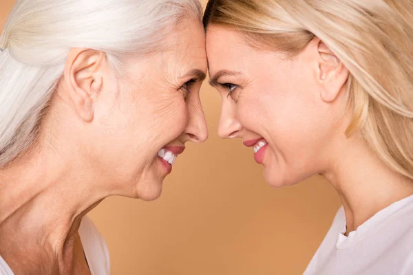 Cropped close-up profile side view portrait of nice-looking winsome sweet tender adorable attractive charming cheerful cheery ladies support care generation isolated over beige pastel background — Stock Photo, Image