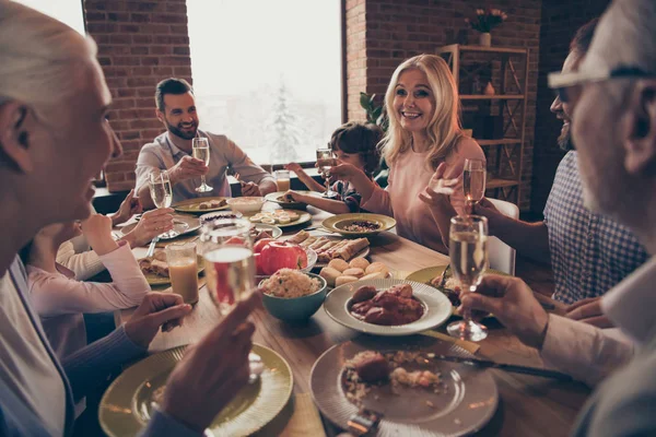 Close up photo big family birthday toast raise wineglasses golden beverage members brother sister granny mom dad grandpa little son daughter sit round festive holiday dishes table loft house indoors — Stock Photo, Image