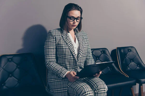 Pretty beautiful intelligent serious with trendy stylish hairdo holding checking she her lady in checkered plaid classic modern suit thoughtfully reading contract — Stock Photo, Image
