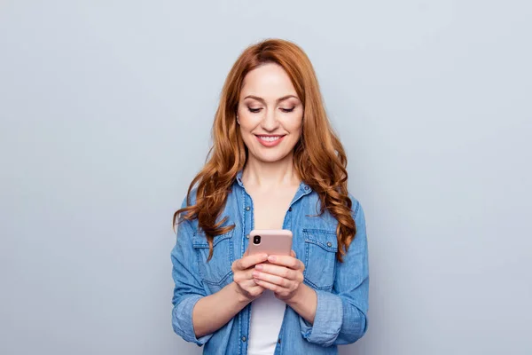 Close up photo beautiful she her her lady arm hand phone smart phone reader look see news check instagram followers stories pictures wear casual blue jeans denim shirt isolated grey background — Foto de Stock