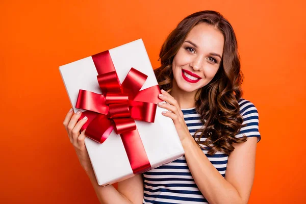 Close up photo beautiful she her her lady arms big large giftbox best guest family meeting red lips pomade excited funky wear casual striped white blue t-shirt clothes isolated orange bright background —  Fotos de Stock