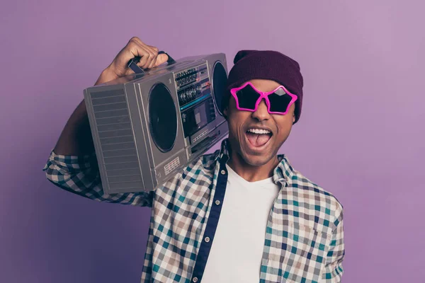 Closeup photo portrait of positive glad optimistic handsome ecstatic funny funky careless in modern street outfit millennial enjoying loud sound from casette player isolated violet background — Stock Photo, Image