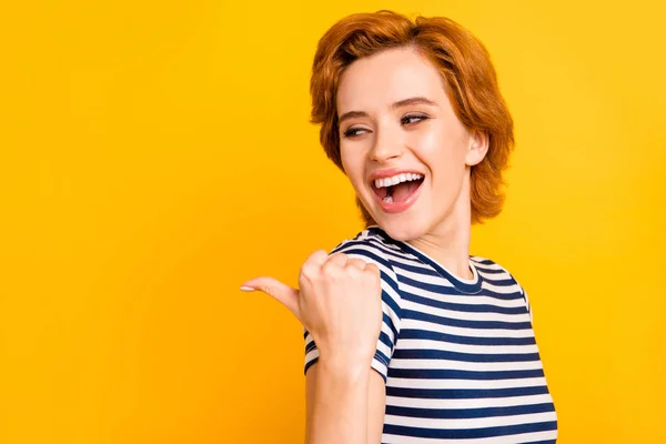 Close up photo beautiful amazing she her lady eyes closed hand arm finger point empty space look advising wear casual striped white blue t-shirt outfit clothes isolated yellow bright vivid background — Stock Photo, Image