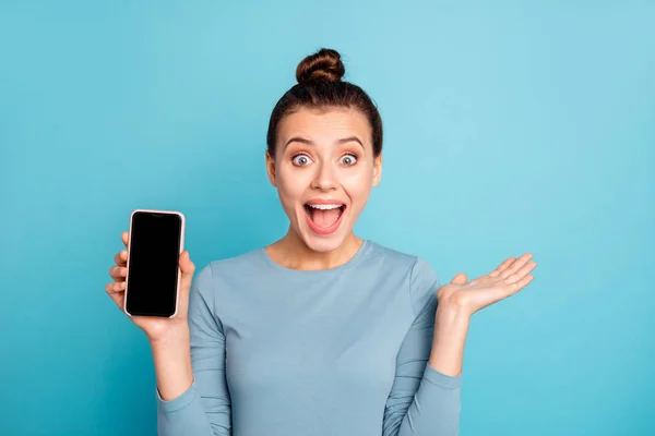 Close-up portrait of her she nice-looking winsome attractive lovely cheerful cheery optimistic girl holding in hand new buying purchase isolated over bright vivid shine turquoise background — Stock Photo, Image