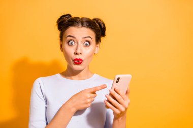 Did you see discounts Portrait of carefree funny funky impressed shocked lady in white woolen outfit pointing at mobile phone over colorful background clipart